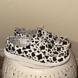 Hey Dude Cow Print Black and White Slip ons